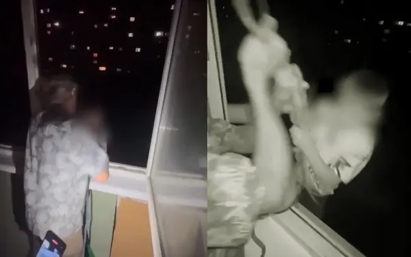 俄羅斯一名父親酒醉後，將年幼兒子綁繩懸掛在80英尺高的7樓窗外，並慢慢下放，嚇得孩子崩潰哭喊「抓住我」。男子不僅冷笑還讓朋友拍攝，直至女性斥責才罷手。影片曝光引全網怒，當局已展開調查。（視頻截圖來源：Telegram平台）