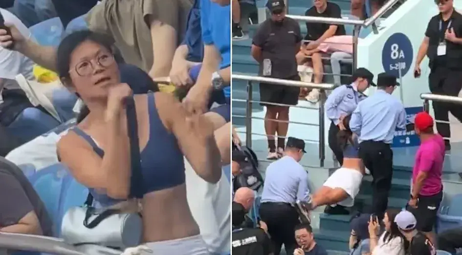 在反覆勸阻無效後，三名保安人員上前實施控制。過程中謝姓女子高喊救命並掙扎反抗，最終被以八字形橫抬離看台，同行小男孩由另一名保安抱離護送。(圖片：視頻翻攝)